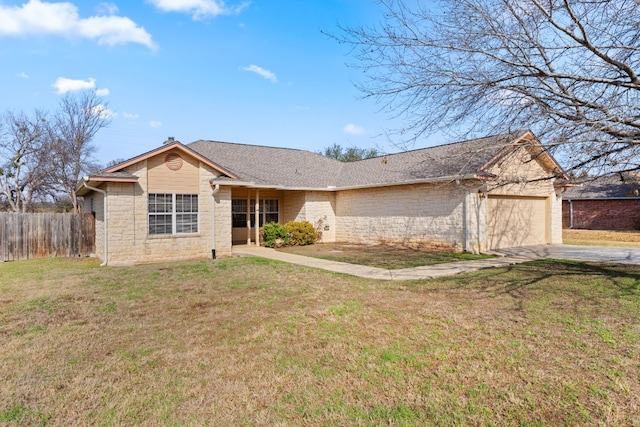 single story home featuring a garage and a front yard