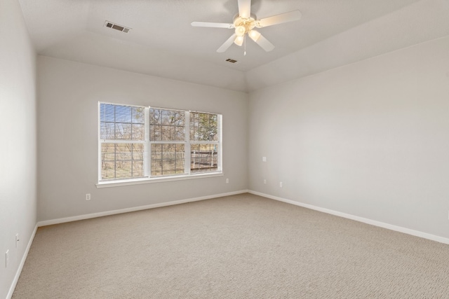 carpeted empty room featuring lofted ceiling and ceiling fan