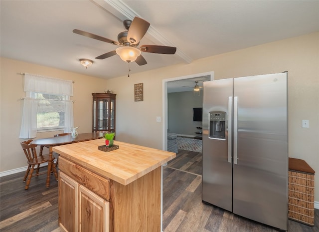 kitchen with stainless steel fridge, dark hardwood / wood-style flooring, ceiling fan, and wooden counters