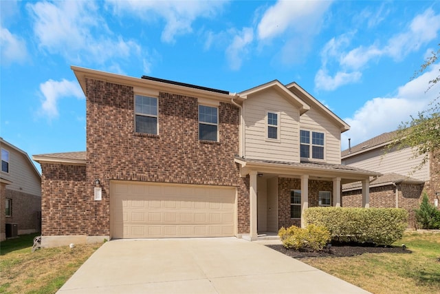 view of front of home featuring cooling unit, a garage, and a front lawn