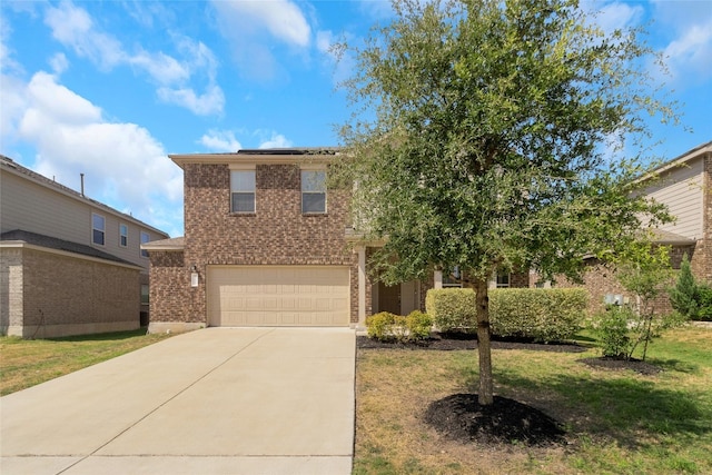 view of front facade with a front yard and a garage