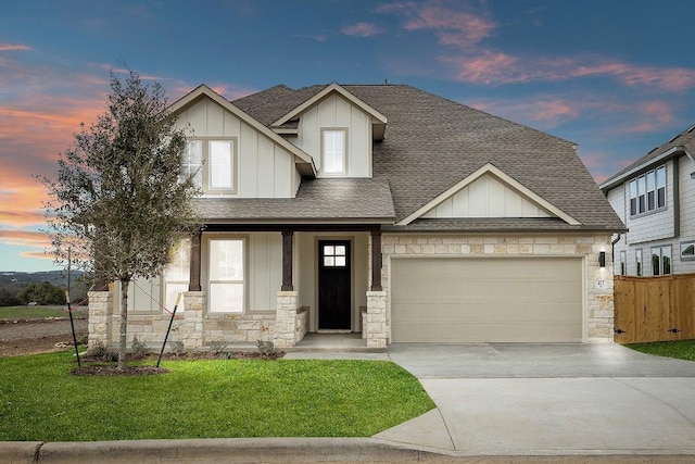 craftsman-style house with board and batten siding, concrete driveway, roof with shingles, and a garage