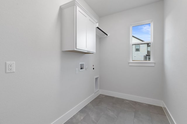 laundry room with washer hookup, cabinet space, hookup for an electric dryer, gas dryer hookup, and baseboards