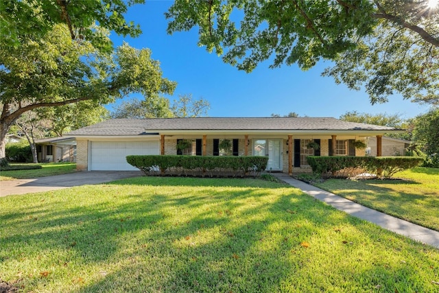 ranch-style home with a front yard and a garage