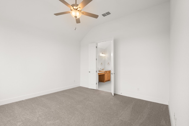 carpeted empty room featuring ceiling fan and lofted ceiling