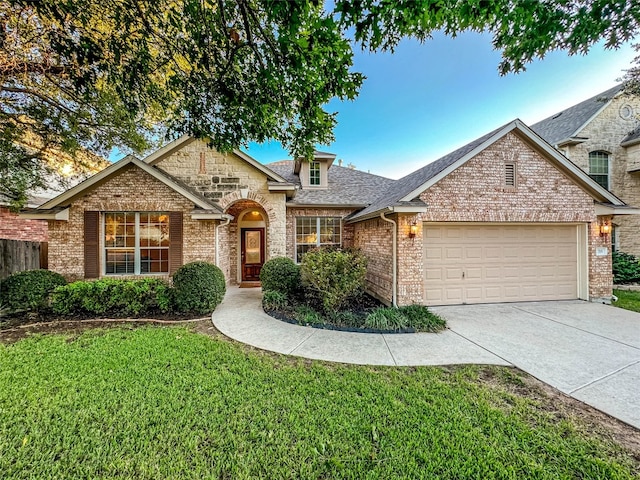 view of front of home featuring a front lawn and a garage