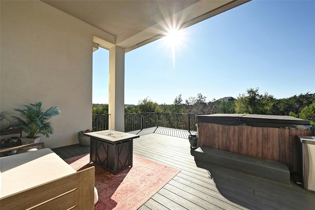 deck featuring a hot tub