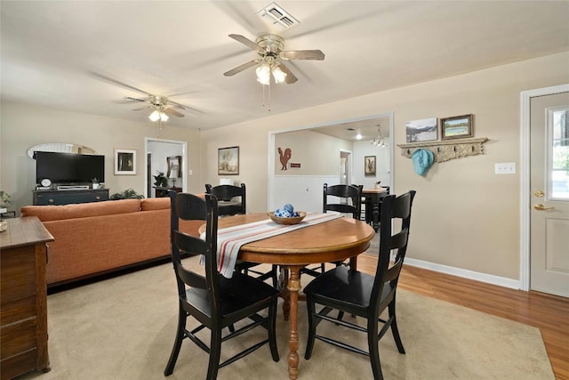 dining space featuring light wood-type flooring and ceiling fan