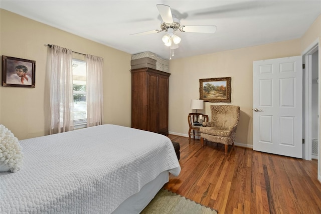 bedroom featuring wood-type flooring and ceiling fan