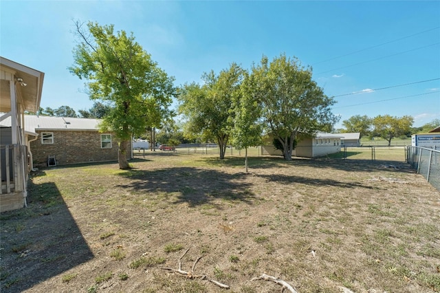 702 S Groos St, Kyle, TX 78640 - view of yard featuring a fenced backyard