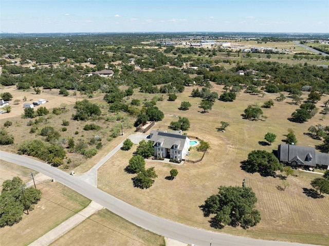 birds eye view of property with a rural view