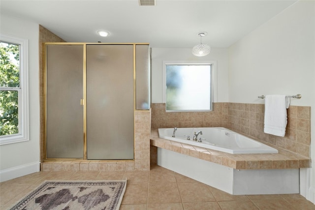 bathroom featuring independent shower and bath and tile patterned flooring