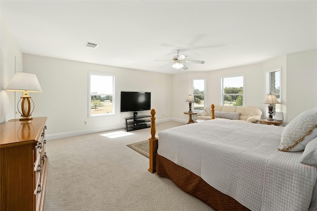 bedroom with ceiling fan and light colored carpet