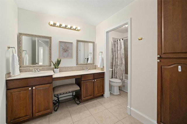 full bathroom with vanity, shower / bath combo with shower curtain, toilet, and tile patterned floors