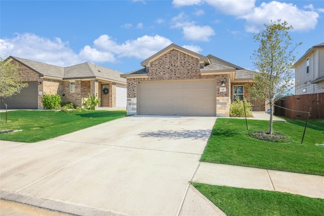 view of front of property featuring a garage and a front lawn