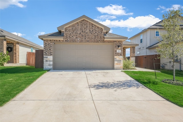 view of front of property with a garage and a front lawn