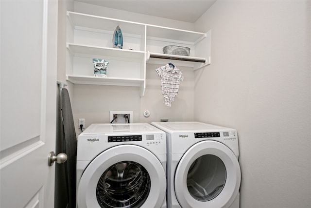 washroom featuring washer and clothes dryer