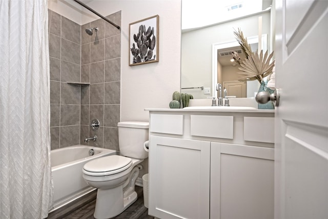 full bathroom featuring vanity, shower / bath combination with curtain, hardwood / wood-style flooring, and toilet