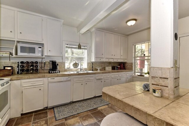 4525 Bell Springs Rd, Dripping Springs, TX 78620 - kitchen featuring white appliances, a wealth of natural light, white cabinets, a sink, and decorative backsplash