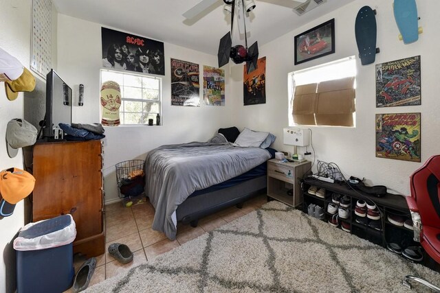 4525 Bell Springs Rd, Dripping Springs, TX 78620 - bedroom featuring visible vents, tile patterned floors, and ceiling fan