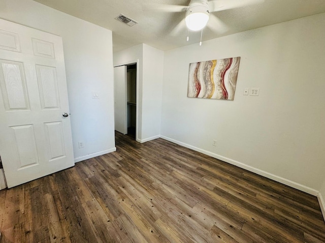 1624 Aquarena Springs Dr Unit G154, San Marcos, TX 78666 - unfurnished bedroom featuring dark wood-type flooring, a closet, and ceiling fan