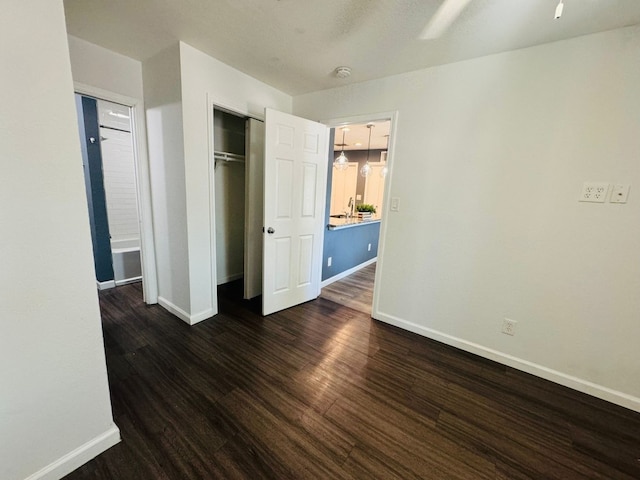 1624 Aquarena Springs Dr Unit G154, San Marcos, TX 78666 - unfurnished bedroom with dark wood-type flooring and a closet