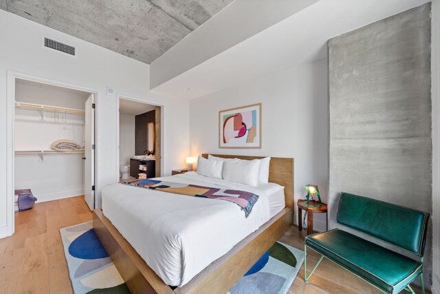 bedroom featuring a closet and hardwood / wood-style floors