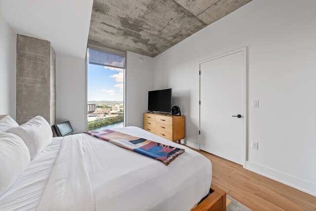 bedroom with wood-type flooring