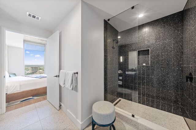 bathroom featuring tiled shower