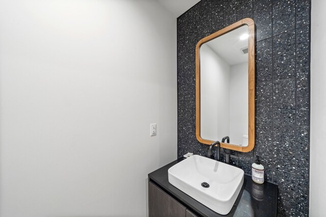 bathroom with backsplash and vanity