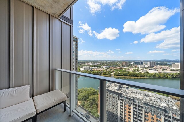 balcony featuring a water view