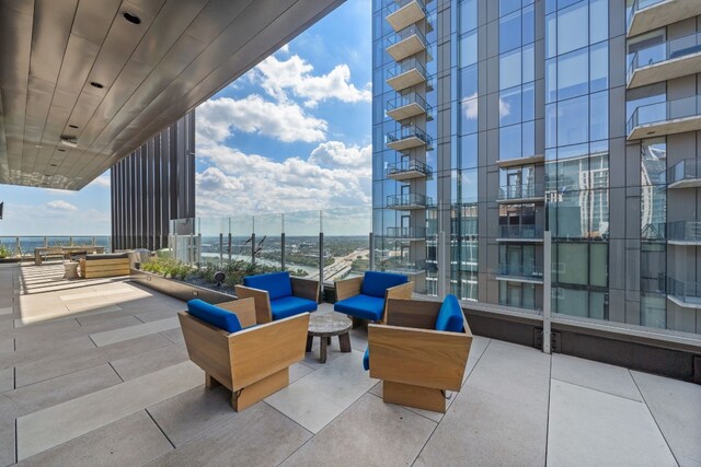 view of patio / terrace featuring a balcony and an outdoor living space