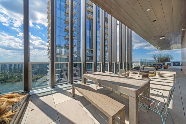 view of patio / terrace featuring an outdoor living space and a water view