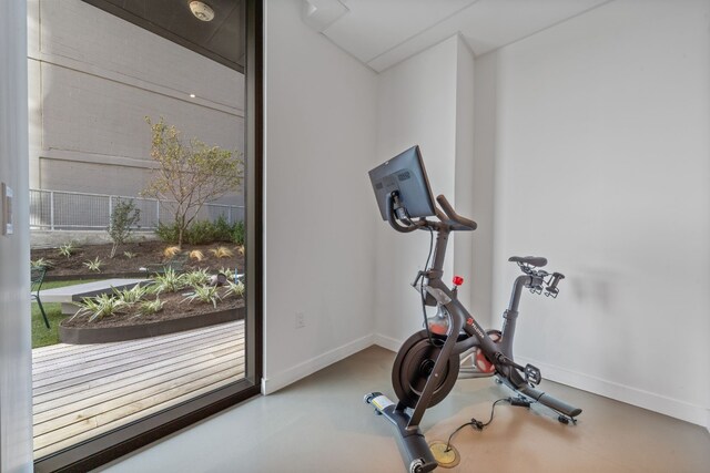 exercise area featuring concrete flooring