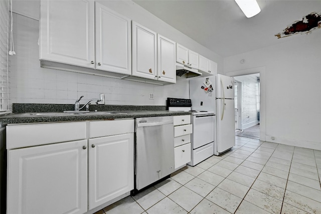 kitchen featuring white appliances, white cabinetry, tasteful backsplash, and sink