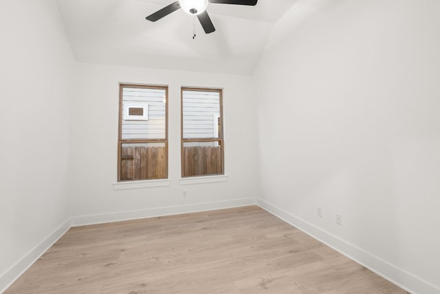 spare room with ceiling fan, light hardwood / wood-style floors, and lofted ceiling