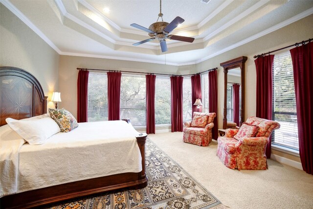 carpeted bedroom featuring multiple windows, crown molding, and ceiling fan