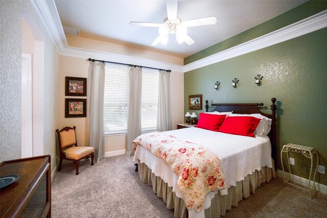 bedroom featuring carpet floors, crown molding, and ceiling fan