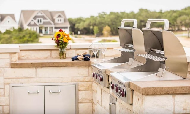 view of patio / terrace featuring exterior kitchen