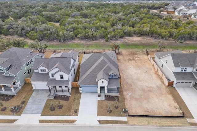 birds eye view of property with a residential view