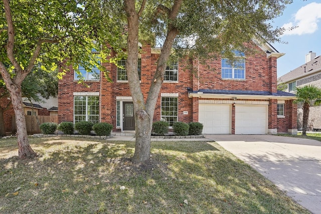 view of front of home featuring a garage and a front lawn