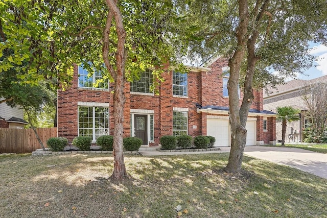 17006 Brewer Blackbird Dr, Pflugerville, TX 78660 - view of front of property with concrete driveway, brick siding, and a garage