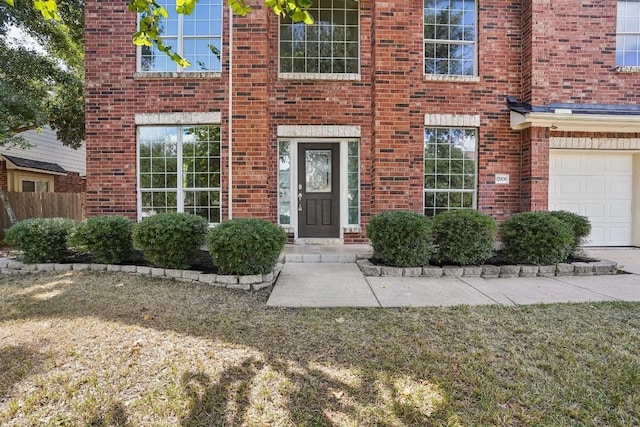 17006 Brewer Blackbird Dr, Pflugerville, TX 78660 - doorway to property with brick siding and an attached garage