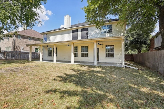 17006 Brewer Blackbird Dr, Pflugerville, TX 78660 - back of property with ceiling fan, a fenced backyard, a chimney, and a patio