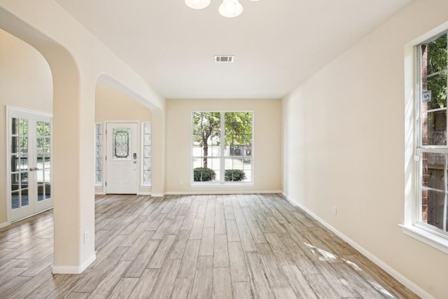 17006 Brewer Blackbird Dr, Pflugerville, TX 78660 - empty room with wood finished floors and plenty of natural light