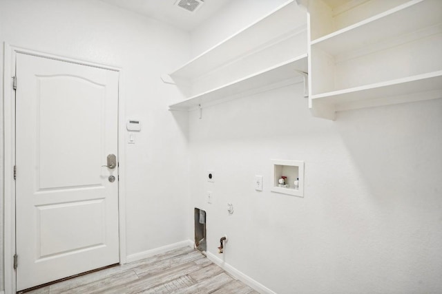 17006 Brewer Blackbird Dr, Pflugerville, TX 78660 - laundry area featuring hookup for a gas dryer, electric dryer hookup, light wood-style flooring, and hookup for a washing machine