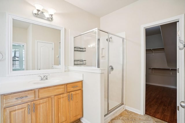 17006 Brewer Blackbird Dr, Pflugerville, TX 78660 - full bathroom featuring a shower stall, vanity, and a spacious closet