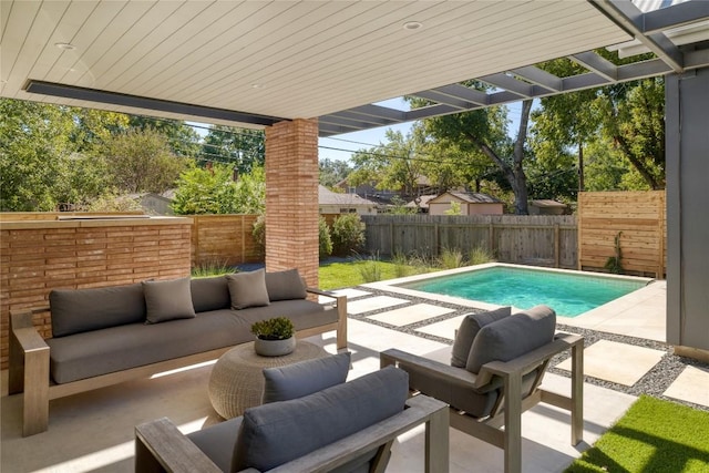 view of swimming pool with an outdoor living space and a patio area