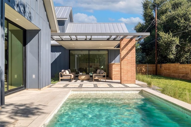 view of swimming pool featuring outdoor lounge area and a patio