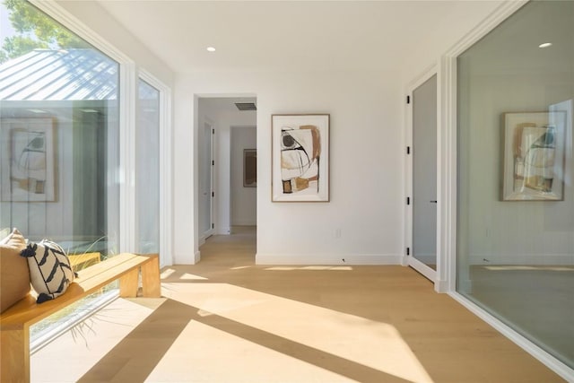 corridor featuring light wood-type flooring